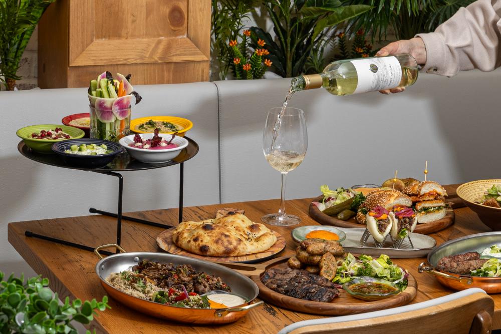 Styled table setting with cocktails and food