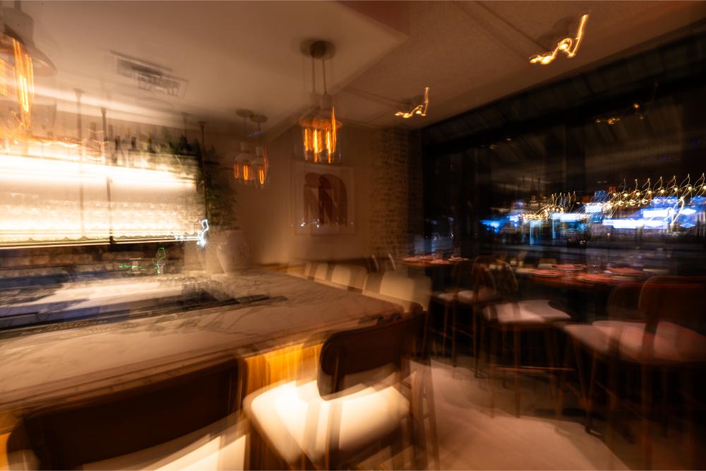 Restaurant interior with glowing bar